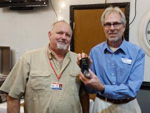 Scott, AC8NW, is presented the Trivia grand prize by Mark, WJ8WM.