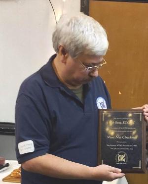 Bob, KC8MRC, is awarded his plaque for most net check-ins for 2021, 2022, and 2023.